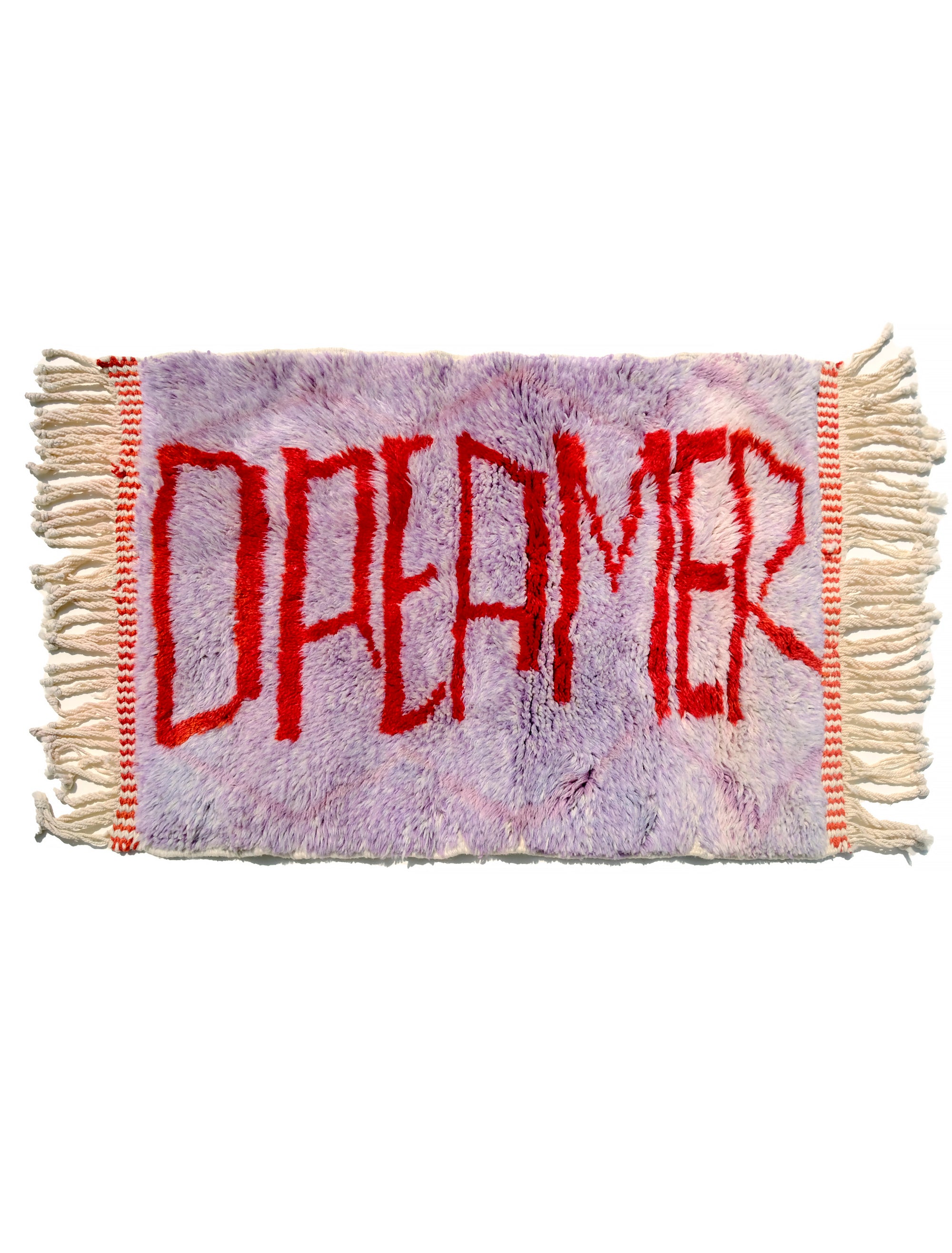Experience the elegance of our 'Royal Dreamscape Rug,' featuring a handwritten 'Dreamer' in red yarn. The light purple base is intricately woven with a subtle Berber pattern, creating a truly unique and enchanting addition to your space. Elevate your decor with this regal blend of design and craftsmanship, where classic beauty meets artistic flair.