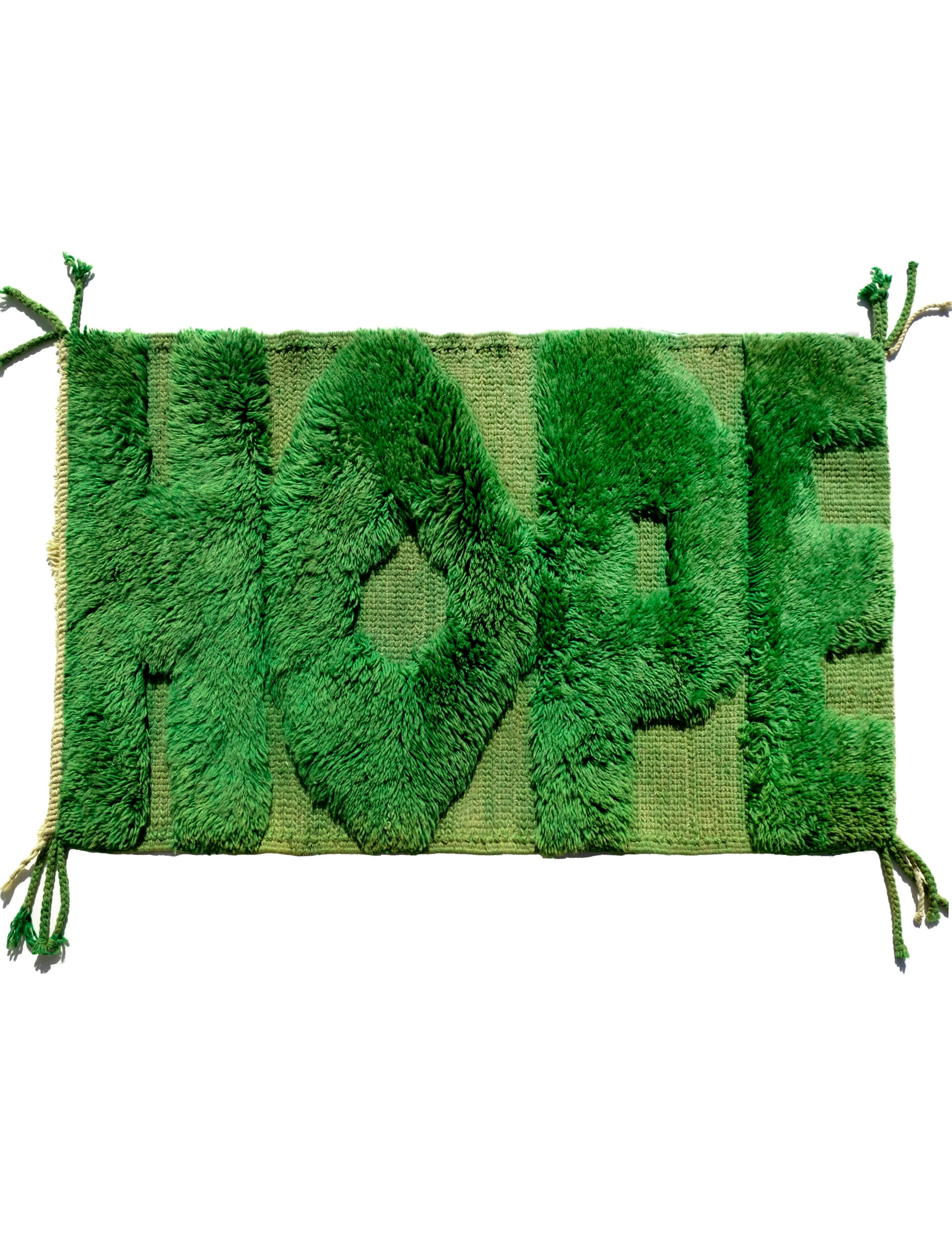 Discover our 'Emerald Fuzzed Hope Rug,' a remarkable fusion of classic sophistication and vibrant playful energy. Expertly crafted with bold knotted 'Hope' letters in rich green yarn, this rug adds a touch of uniqueness to any space. The textured charm and spirited design make it a captivating addition that brings positive energy and timeless elegance to your home.