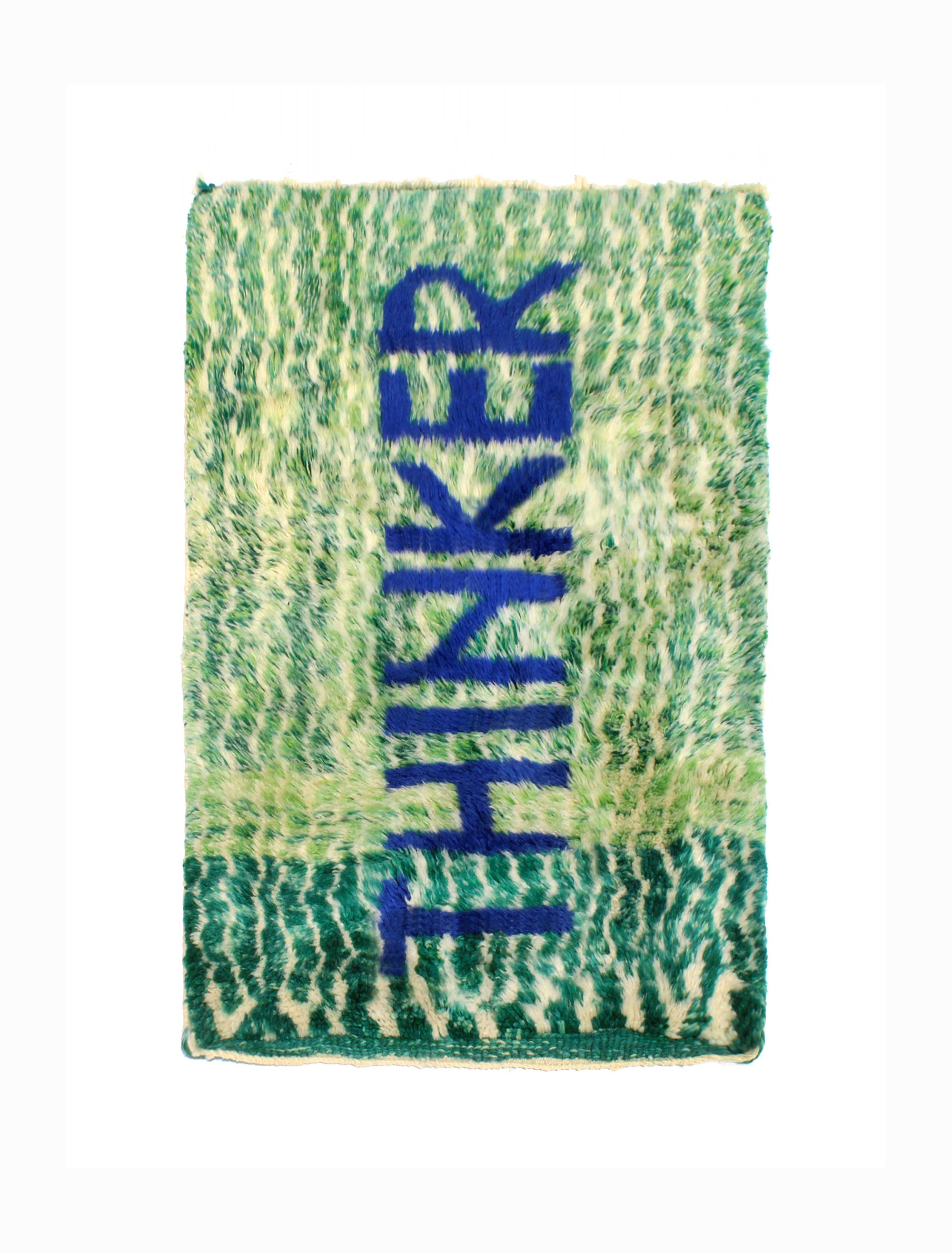 Introducing the 'Verdant Thinker Rug,' where the profound 'Thinker' letter is meticulously woven in blue yarn. Set against a backdrop of unique green and ivory curved wave lines, this rug brings a touch of intellectual charm to your space. Elevate your home with its artistic blend of colors and textures, creating a vibrant and thoughtful ambiance that resonates with modern sophistication.