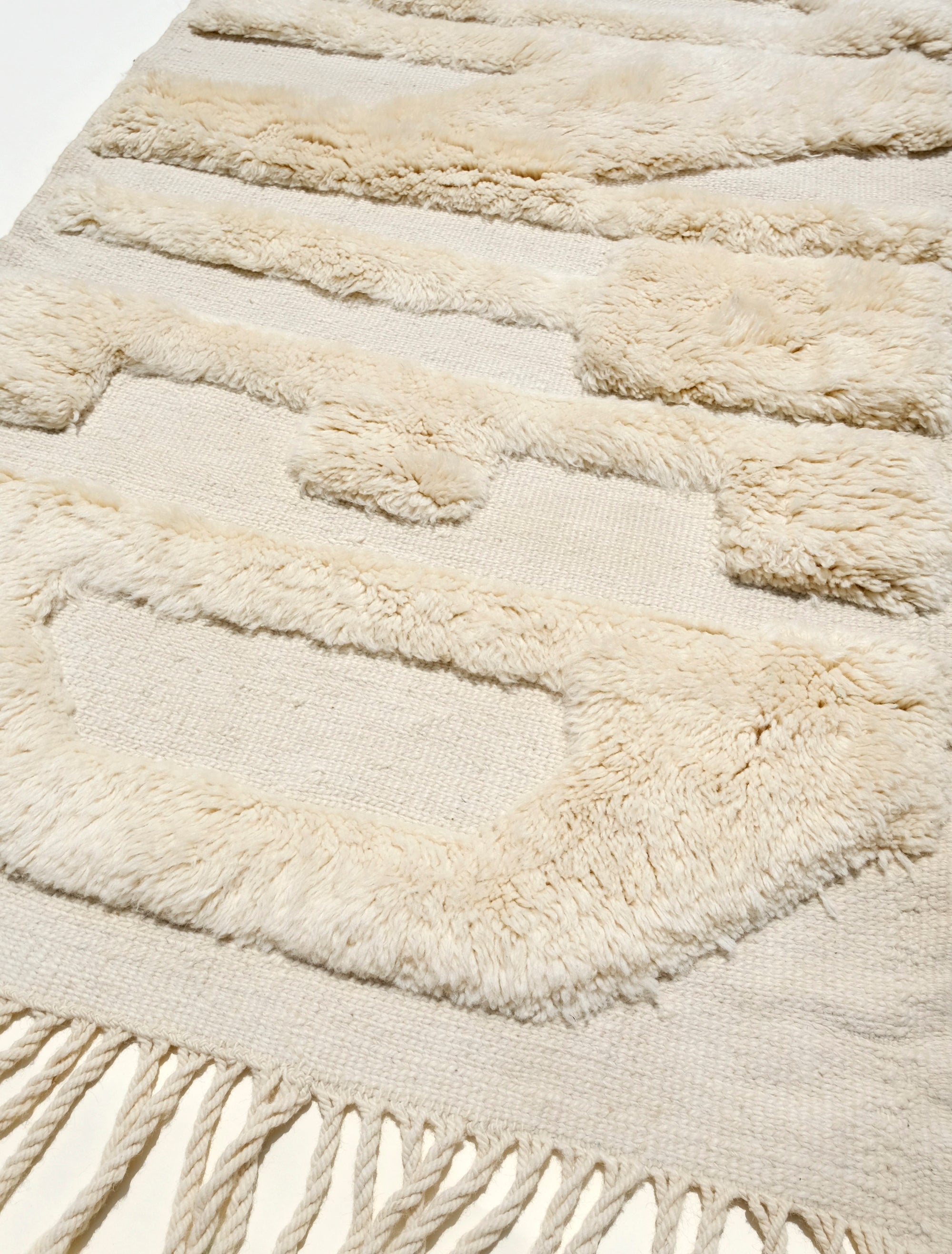 "Ivory Whispers Wanted Rug" is the epitome of sophistication and positivity. Handcrafted from luxurious ivory yarn, this rug features the subtle yet impactful message of 'WANTED' in soft, fuzzy lettering. The flat weaving base provides a cozy and timeless feel, making it a perfect addition to any space. Bring a touch of elegance and a dash of inspiration to your home with this classic ivory rug that delivers a positive message.