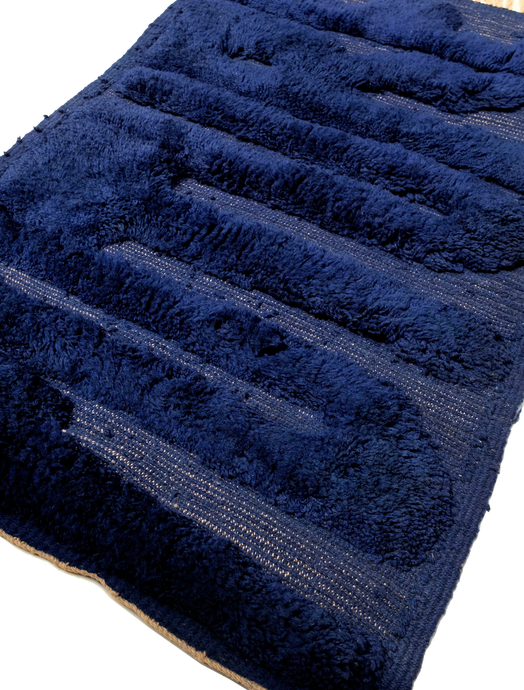 Transform your space with our 'Midnight Future Rug,' a stunning navy wool rug adorned with the enigmatic word 'FUTURE.' Its flat weaving base and captivating design add a touch of modern mystique to your decor. Elevate your ambiance with this rug that combines classic sophistication with contemporary flair.