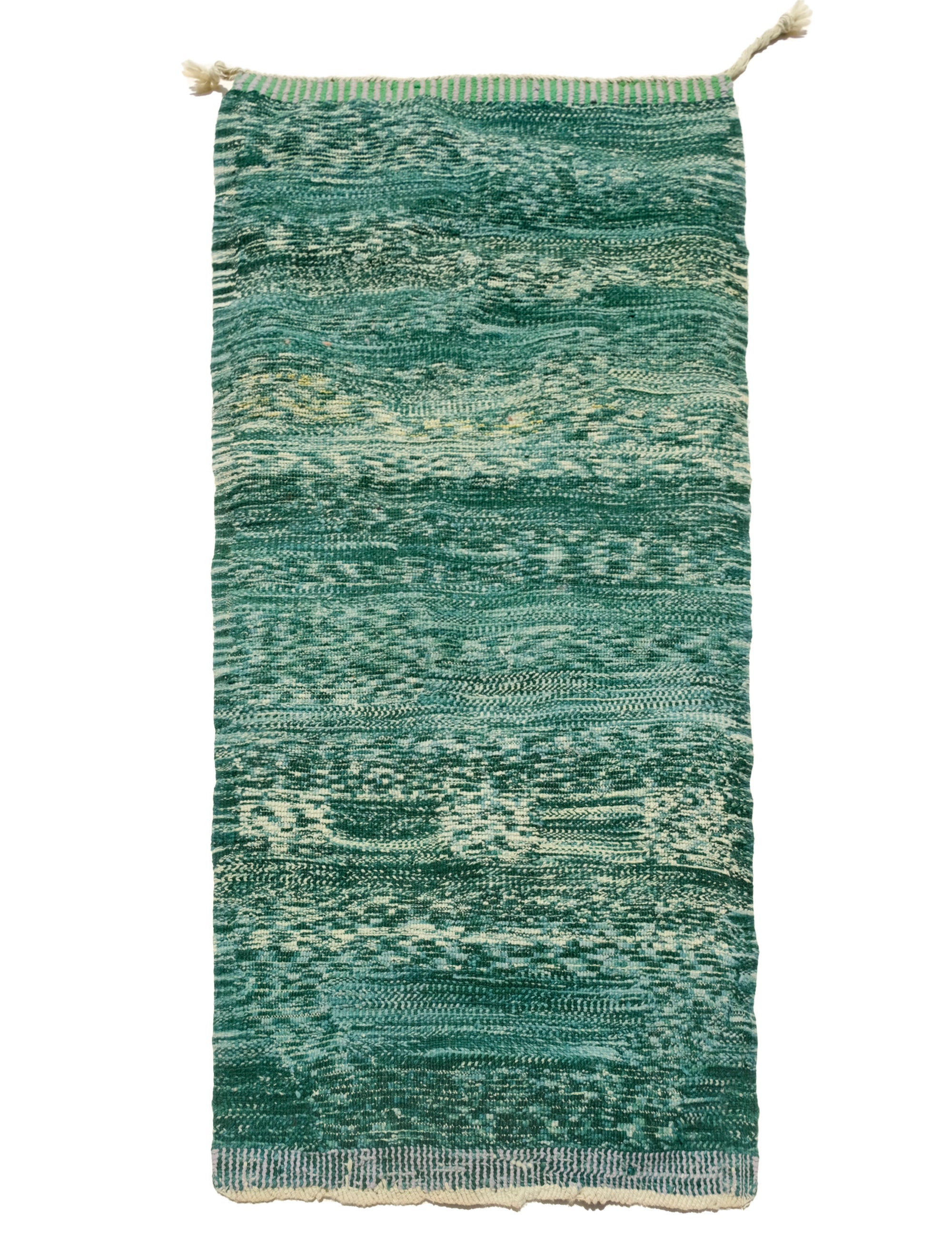 "Verdant Whispers Wanted Rug" – lush greens and an intriguing message woven with a playful touch. Perfect for adding a unique, contemporary element to your space.