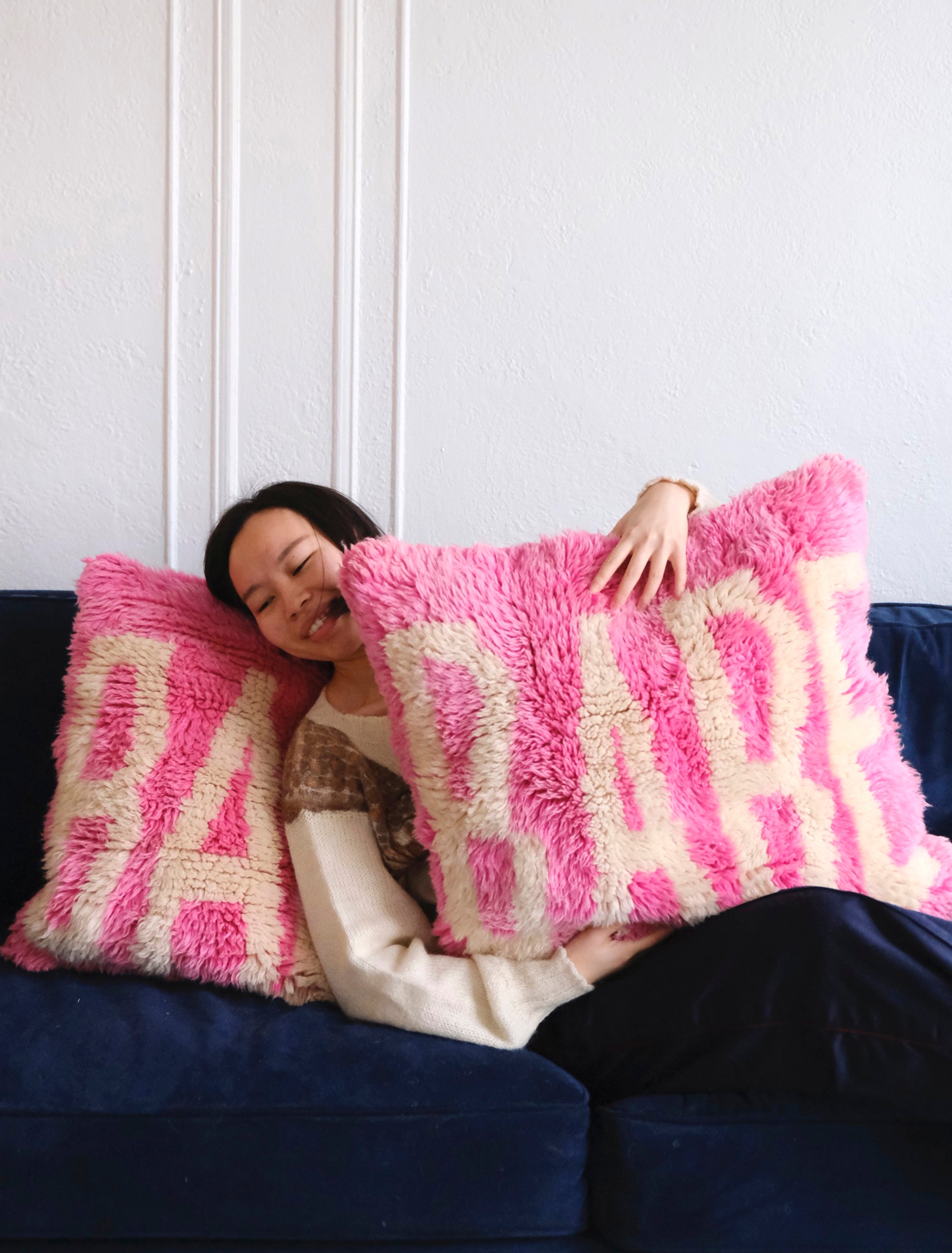 Meet our latest cushion made from a Beni Mrirt rug. Vibrant neon pink, adorned with the word "BABE" in white yarn, this 55x55cm delight effortlessly infuses joy into any space. It's not just decor; it's a celebration of style and comfort. Watch your room bloom with the playful charm of "Babe in Bloom," a vivid testament to the power of color and design.