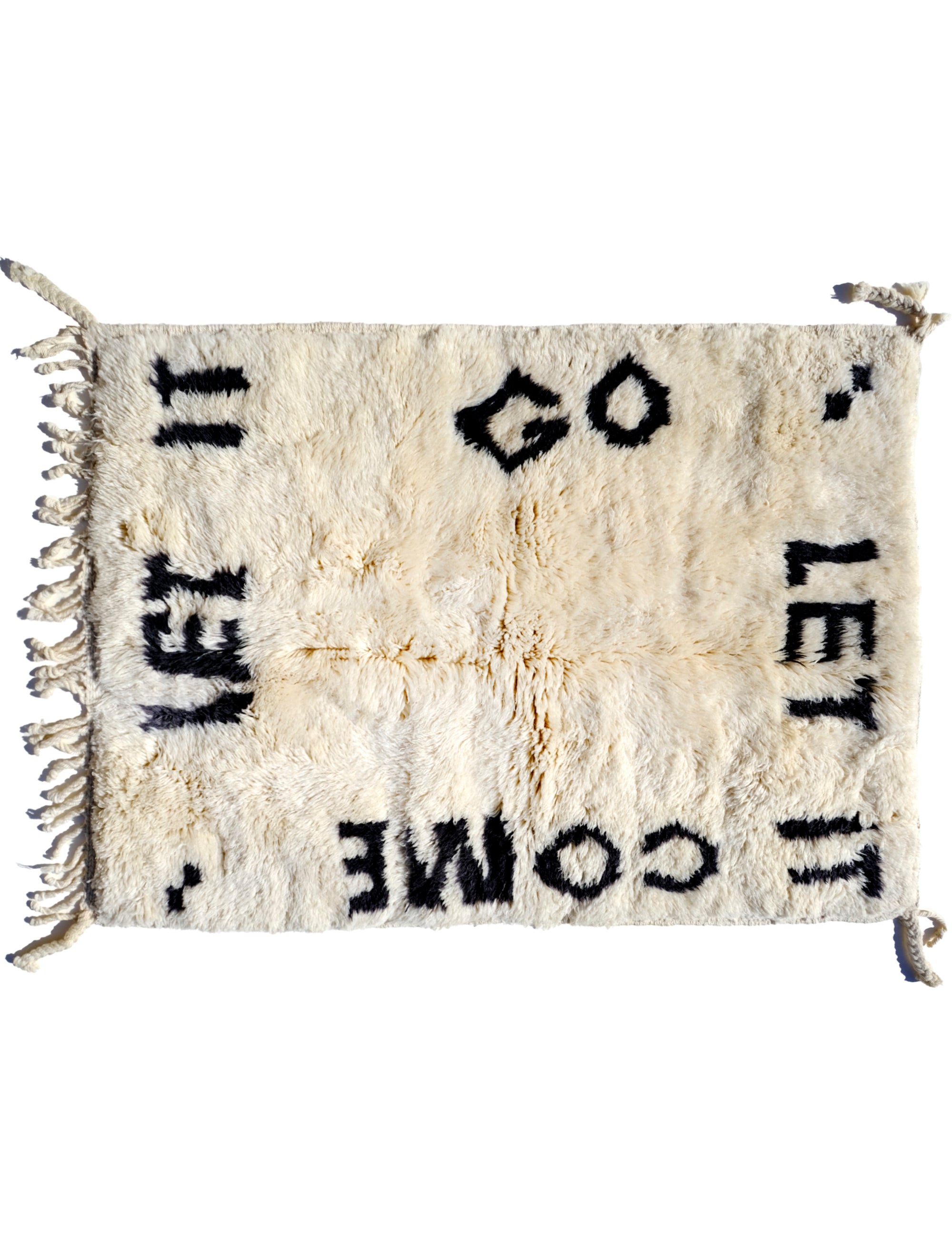 Indulge in comfort with our Ivory Serene Affirmations Rug, handcrafted in the Atlas Mountains. Its plush fibers offer a luxurious experience, while the subtle saying, 'let it come, let it go,' brings a calming touch to your space. Immerse yourself in Moroccan craftsmanship, transforming your home into a haven of tranquility.