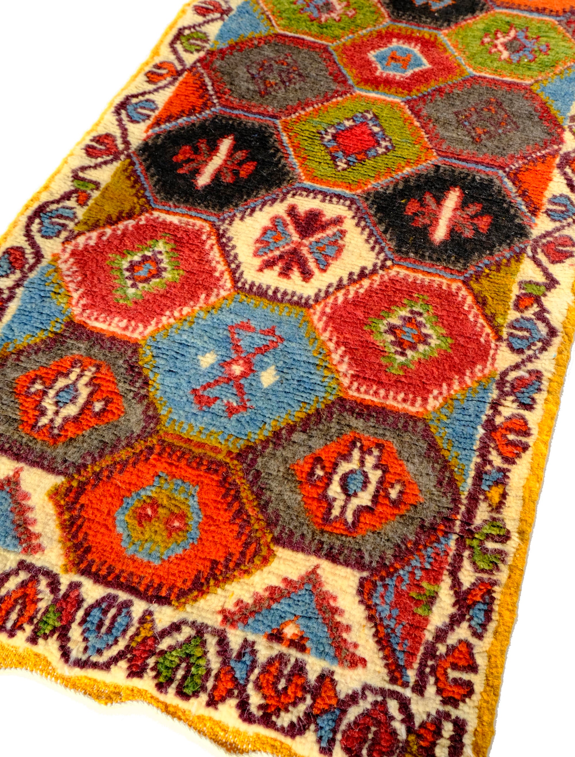 Elevate your space with the Nomad's Embrace Taznakht Rug. This Moroccan-inspired masterpiece boasts a multicolor hexagon pattern, intricately piled up for a textured finish. Traditional yet contemporary, it adds warmth to any room. Bring cultural heritage to your home with this uniquely crafted Taznakht rug.