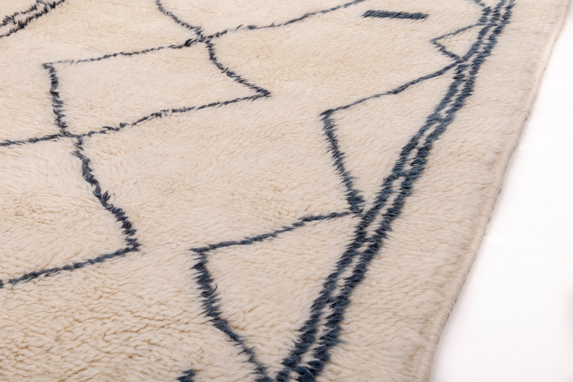 Enhance your space with our Ivory Geometric Maze Rug. This captivating piece features an ivory base adorned with an abstract irregular crisscross pattern and small black squares at the top, adding intrigue and sophistication to your decor.
