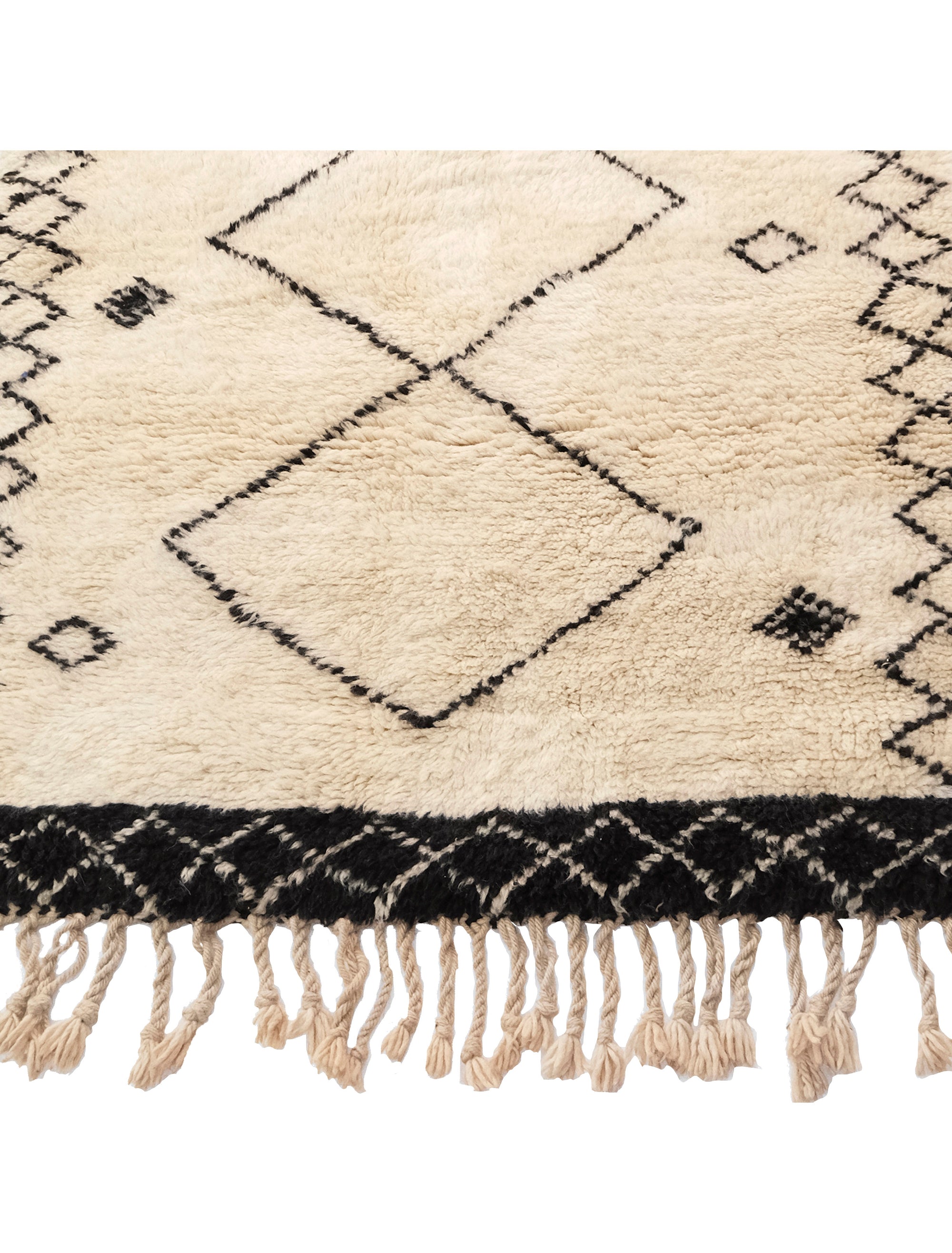 Discover elegance with our "Monochrome Diamond Ensemble" Beni Ourain Rug. Its ivory base features three prominent diamond shapes in a delicate black outline at the center, complemented by two rows of smaller diamonds on each side. Meticulously crafted, this rug effortlessly blends tradition and modern design, making it a versatile and captivating addition to any space.