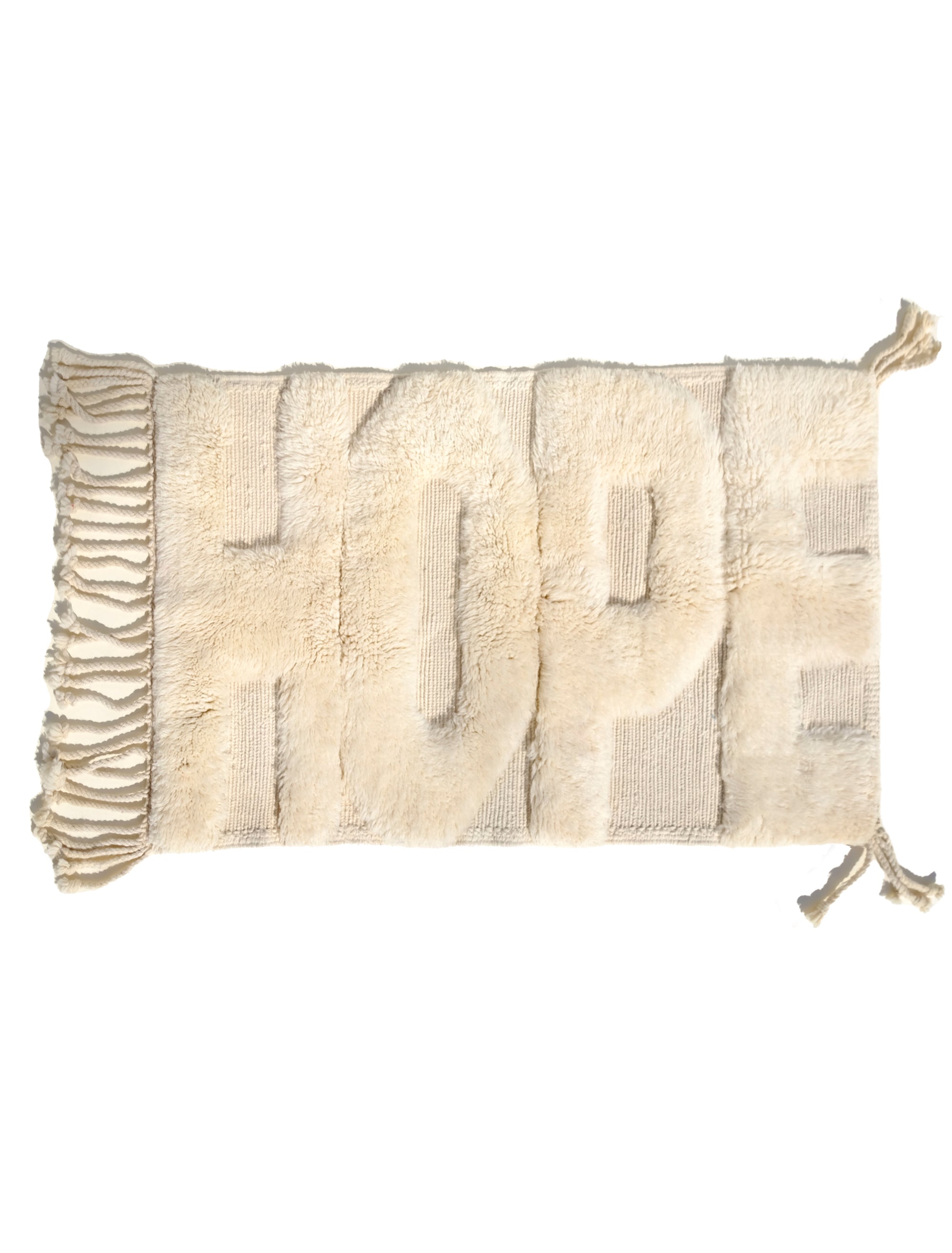 Introducing our 'Ivory Fuzzed Hope Rug,' a masterful blend of timeless sophistication and vibrant playfulness. Crafted with meticulous care, this rug features bold knotted 'Hope' letters that bring a touch of uniqueness to your space. The charming texture and spirited design infuse your home with positive energy, creating a perfect balance of classic elegance and joyful exuberance.